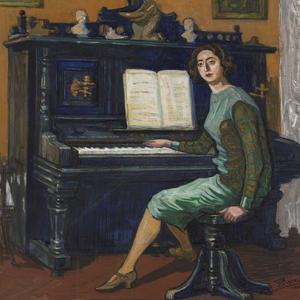 Młoda kobieta przy pianinie